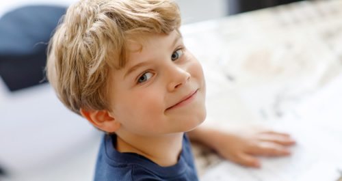 Child reading in bilingual preschool and elementary school paris